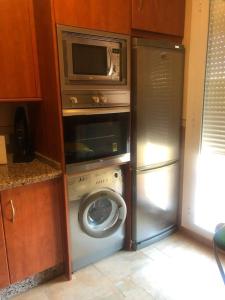 Kuchyň nebo kuchyňský kout v ubytování Duplex Penthouse "Playa Y Palmeras"