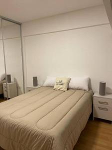 A bed or beds in a room at Departamento 2 amb Villa Urquiza