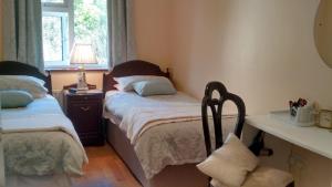 Postel nebo postele na pokoji v ubytování Corrib View Guesthouse h91rr72