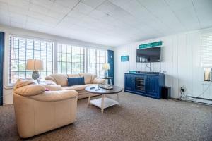 a living room with a couch and a table at Sea View Motel in Ogunquit