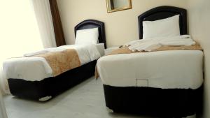 Postel nebo postele na pokoji v ubytování Tolga Hotel