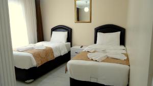 Postel nebo postele na pokoji v ubytování Tolga Hotel