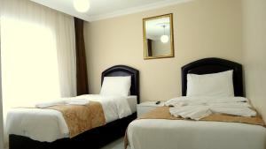 Postel nebo postele na pokoji v ubytování Tolga Hotel + 37 fotografií