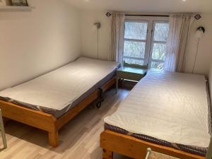 Postel nebo postele na pokoji v ubytování Holiday home Dannemare XL
