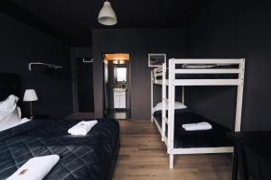 Postel nebo postele na pokoji v ubytování Brim Hotel