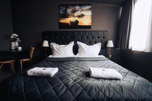 Postel nebo postele na pokoji v ubytování Brim Hotel