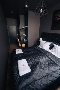 Postel nebo postele na pokoji v ubytování Brim Hotel