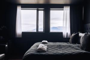 Postel nebo postele na pokoji v ubytování Brim Hotel