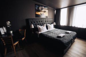 Postel nebo postele na pokoji v ubytování Brim Hotel