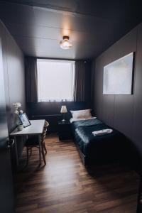 Postel nebo postele na pokoji v ubytování Brim Hotel