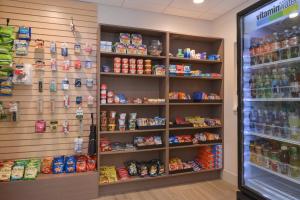 a store aisle with shelves of food and drinks at Holiday Inn Express Hotel & Suites Indianapolis Dtn-Conv Ctr, an IHG Hotel in Indianapolis