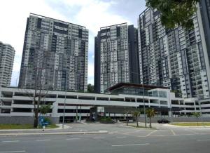 a parking lot in front of some tall buildings at HMM Lili - Nilai in Nilai