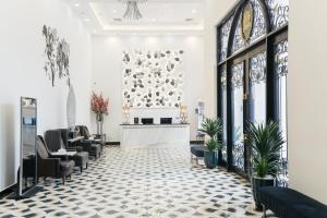 a salon with chairs and a waiting room at SureStay Hotel by Best Western Vientiane in Vientiane