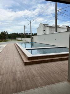 a swimming pool on the roof of a house at Lençóis Confort - BL05-AP02 in Barreirinhas