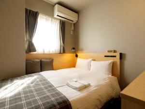 Un ou plusieurs lits dans un hébergement de l'établissement Hotel La Foresta By Rigna