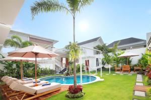 an image of a villa with a swimming pool at Aeera Villa Canggu by Ini Vie Hospitality in Canggu