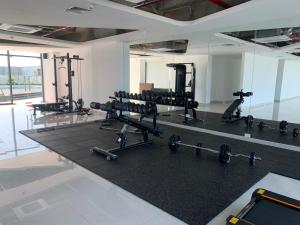 a gym with several treadmills and weights at Nera House in Hue