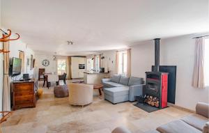 a living room with a couch and a stove at Amazing Home In Fayence With Wifi in Fayence