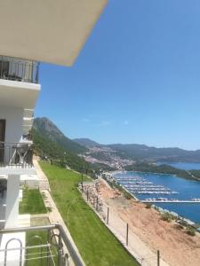 a view of the water from the balcony of a building at Kaş Şirinevler Apart in Kaş
