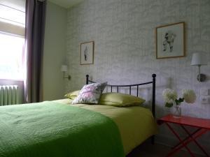 Katil atau katil-katil dalam bilik di Un gîte dans la vallée