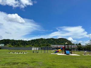 a park with a playground with a slide at Aisy Guest House - MUSLlM Only in Kangar