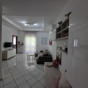 a living room with a couch and a table at Casa Signorile in Pompei