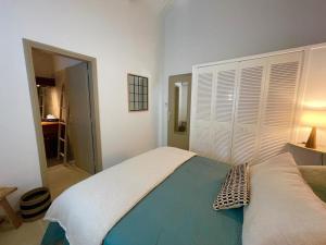 En eller flere senge i et værelse på Mahi-Mahi Lodge, piscine privee, orient bay
