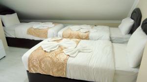 Postel nebo postele na pokoji v ubytování Tolga Hotel