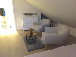 Posezení v ubytování Penthouse "Meerzeit" Kellenhusen mit Strandkorb