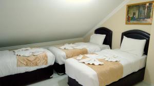Postel nebo postele na pokoji v ubytování Tolga Hotel