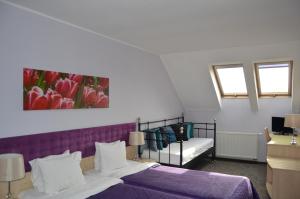 Postel nebo postele na pokoji v ubytování B&B Landrynka