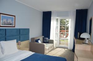 Postel nebo postele na pokoji v ubytování B&B Landrynka