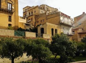 a group of buildings with trees in front of them at Il Sole e La Luna in Agrigento