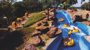 a group of people on a water slide at a water park at Unit 24 Pendleberry Grove Holidays in Bela-Bela