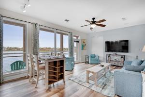 a living room with a couch and a table at Destiny Beach Villas #15A in Destin