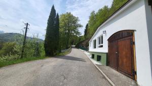 a house with a garage on the side of a road at Maal Waldhaus in Todtnau