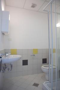 a bathroom with a sink and a toilet at Garni Hotel Siesta in Nova Gorica