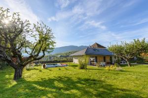 a house with a yard with a swimming pool at Charmante maison avec Vue LAC et Montagnes - PISCINE privative - LLA Selections by Location lac Annecy in Saint-Jorioz