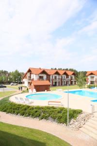 an image of a swimming pool at a house at Apartament Może Morze Łebska Ostoja in Żarnowska