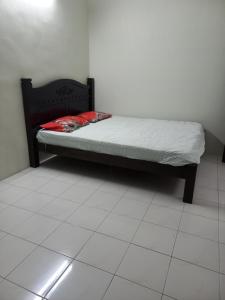 Ένα ή περισσότερα κρεβάτια σε δωμάτιο στο AB Tambun Homestay