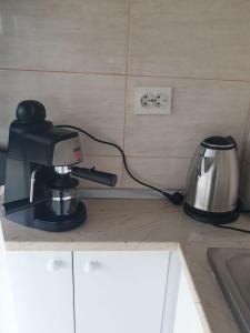 a coffee maker sitting on a counter in a kitchen at Studio Saturn in Saturn