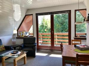 a living room with a couch and a table at Ferienwohnung Emmi in Malente