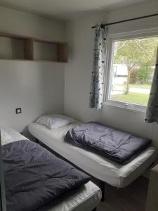 Postel nebo postele na pokoji v ubytování Camping les Lavandes, Castellane