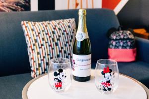 a bottle of wine and two wine glasses on a table at Fairfield by Marriott Anaheim Resort in Anaheim