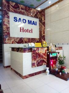 a sao mai hotel sign on a wall in a lobby at KHÁCH SẠN SAO MAI in Ho Chi Minh City