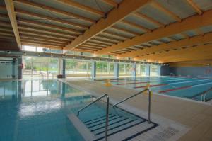 an empty swimming pool with a row of lanes at Ca la Pauleta in Sant Hilari Sacalm