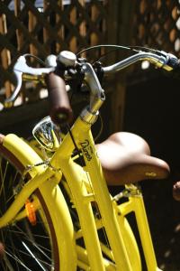 a yellow bike parked next to a person at Hotel des Dunes in Cap-Ferret