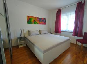 Postel nebo postele na pokoji v ubytování Villa Milan