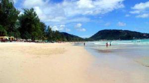 a beach with a lot of people on it at Benetti house in Patong Beach