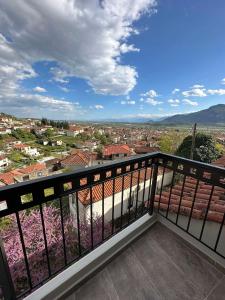 a balcony with a view of a city at Meteora Sunrise in Kalabaka